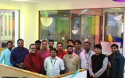 Systweak team members in office meeting area
